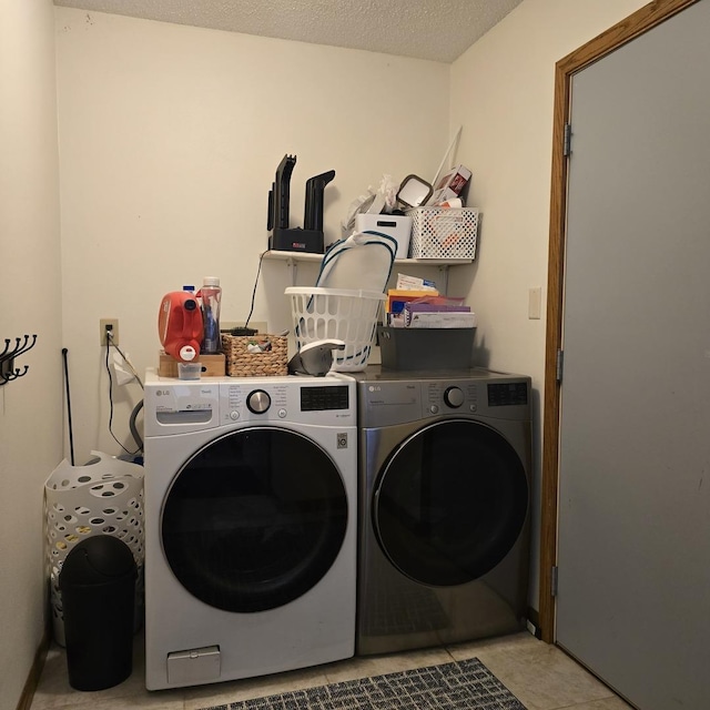 laundry area featuring washer and dryer and laundry area