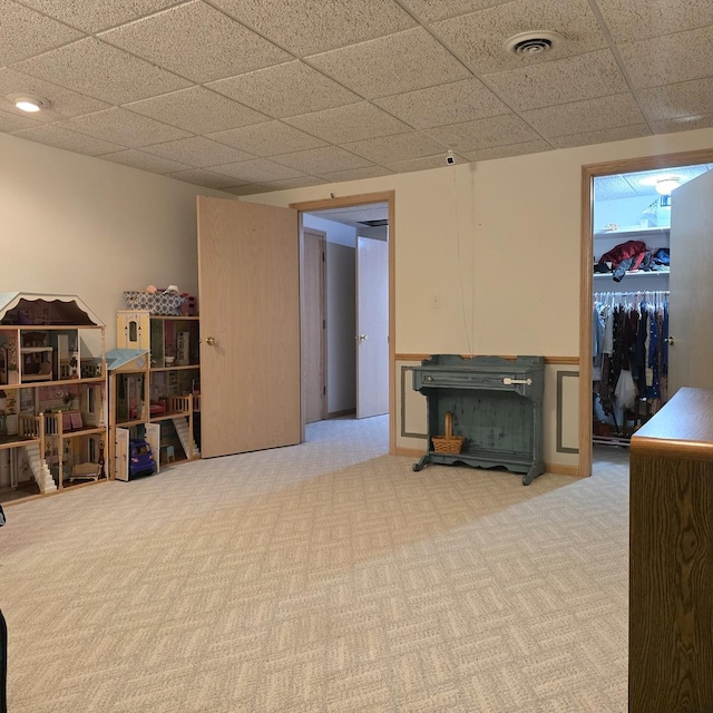 finished below grade area with carpet flooring and visible vents
