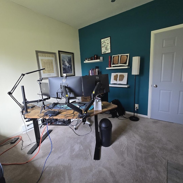 carpeted office space with baseboards