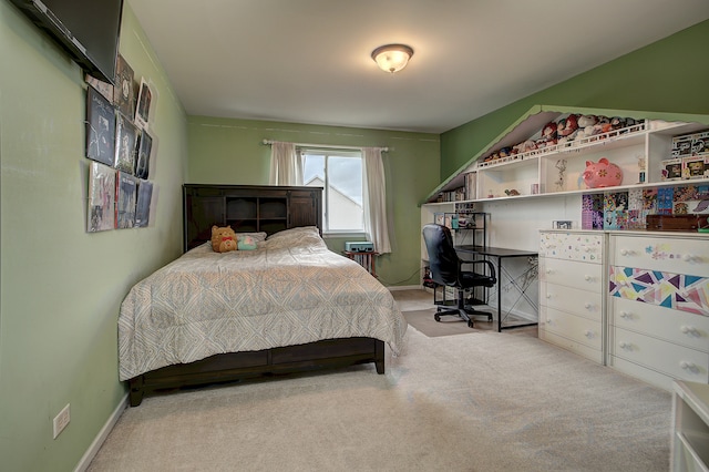 bedroom with carpet floors and baseboards
