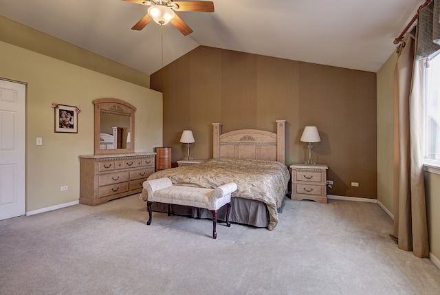 bedroom featuring light colored carpet, lofted ceiling, and baseboards