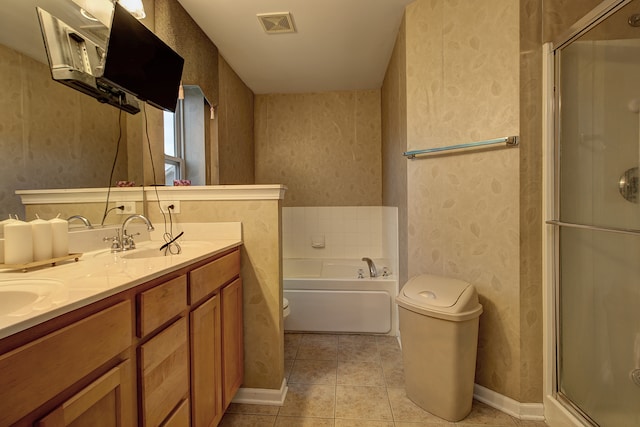 full bath with wallpapered walls, toilet, a sink, visible vents, and a stall shower