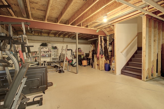 unfinished below grade area featuring stairs