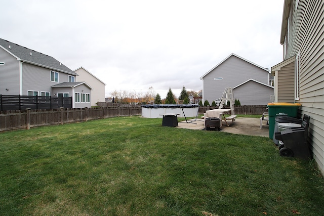 view of yard featuring a fenced in pool, a patio area, and a fenced backyard