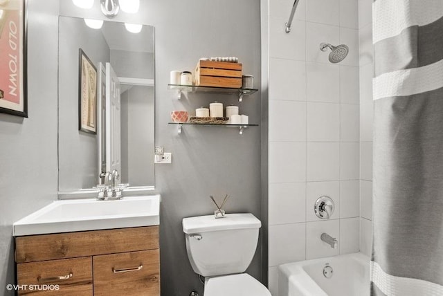 bathroom with vanity, toilet, and shower / tub combo