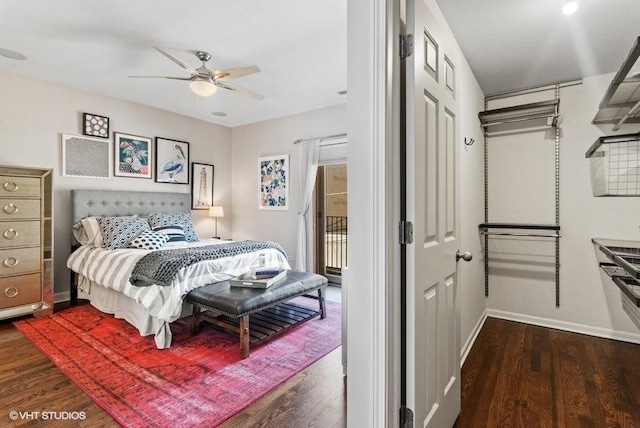 bedroom featuring a ceiling fan, baseboards, access to exterior, and wood finished floors