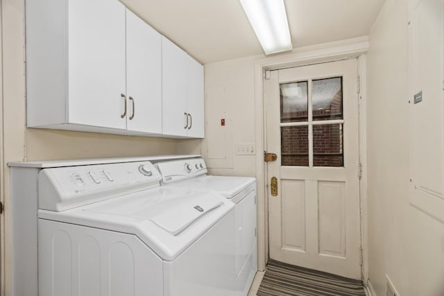 2717 Harrison St, Evanston, IL 60201 - laundry room featuring cabinet space and washing machine and dryer