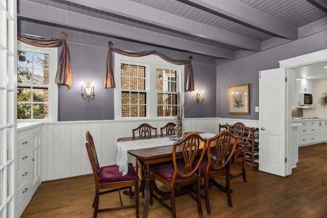 2717 Harrison St, Evanston, IL 60201 - dining area with a wainscoted wall, beam ceiling, and dark wood-type flooring