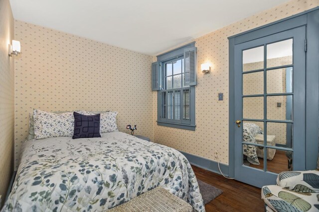 2717 Harrison St, Evanston, IL 60201 - bedroom featuring dark wood-style flooring, wallpapered walls, and baseboards