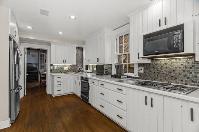 2717 Harrison St, Evanston, IL 60201 - kitchen with dark wood finished floors, black appliances, backsplash, and light countertops