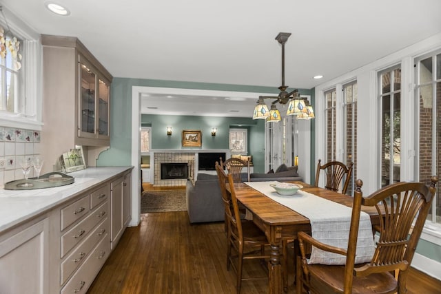 2717 Harrison St, Evanston, IL 60201 - dining room featuring recessed lighting, dark wood-style floors, and a brick fireplace