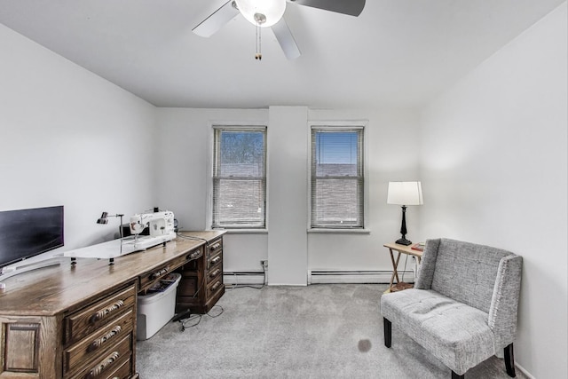 carpeted office with a ceiling fan and a baseboard heating unit