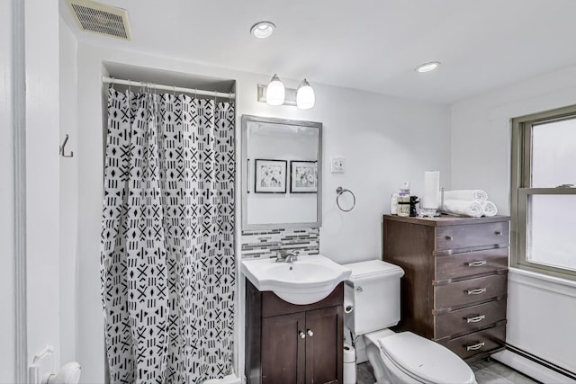 full bathroom with a shower with curtain, visible vents, vanity, a baseboard heating unit, and toilet