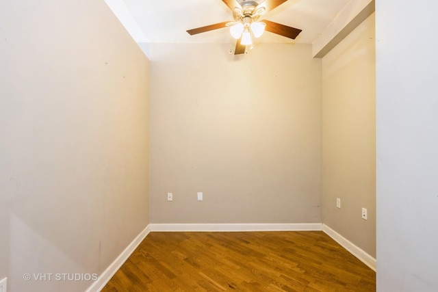 unfurnished room featuring wood finished floors, ceiling fan, and baseboards