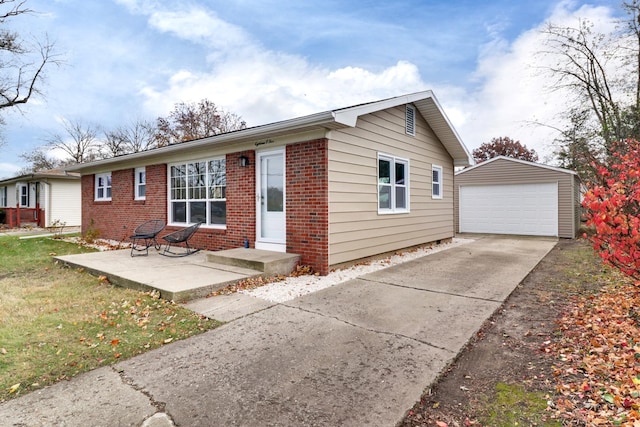 ranch-style home with an outdoor structure, a detached garage, driveway, and brick siding