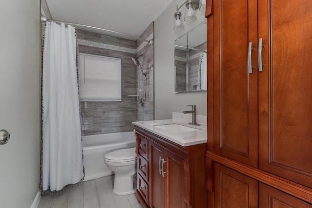 bathroom with shower / bathtub combination with curtain, toilet, and vanity