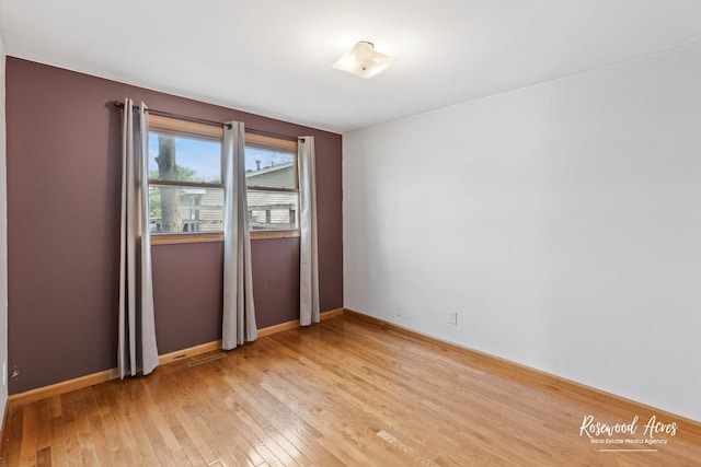 510 W 3rd St, Braidwood, IL 60408 - empty room with baseboards and light wood-type flooring