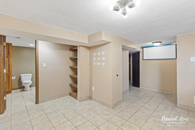 510 W 3rd St, Braidwood, IL 60408 - finished below grade area featuring light tile patterned flooring and baseboards