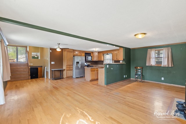 510 W 3rd St, Braidwood, IL 60408 - kitchen featuring light wood-style floors, baseboards, stainless steel appliances, and light countertops