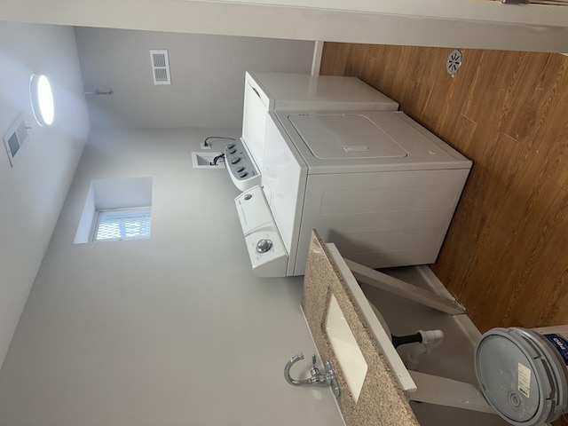 laundry area with visible vents, washer and dryer, and laundry area