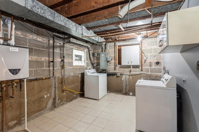 below grade area with washing machine and clothes dryer, light tile patterned flooring, tankless water heater, and electric panel