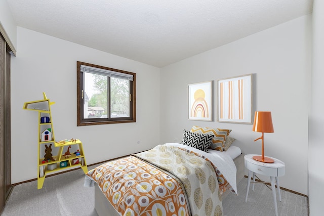 carpeted bedroom with baseboards