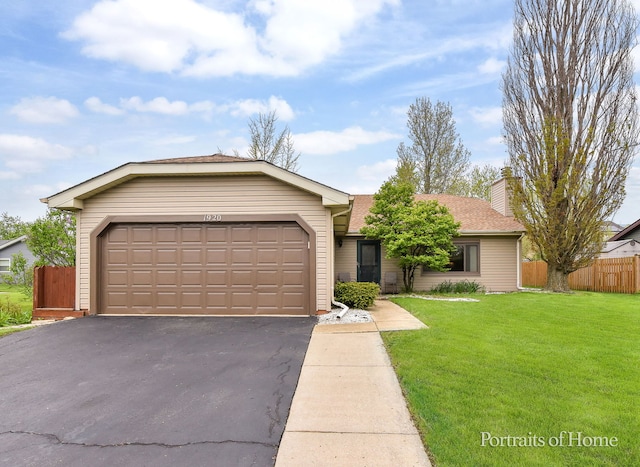 ranch-style home featuring a garage, fence, a chimney, a front lawn, and driveway