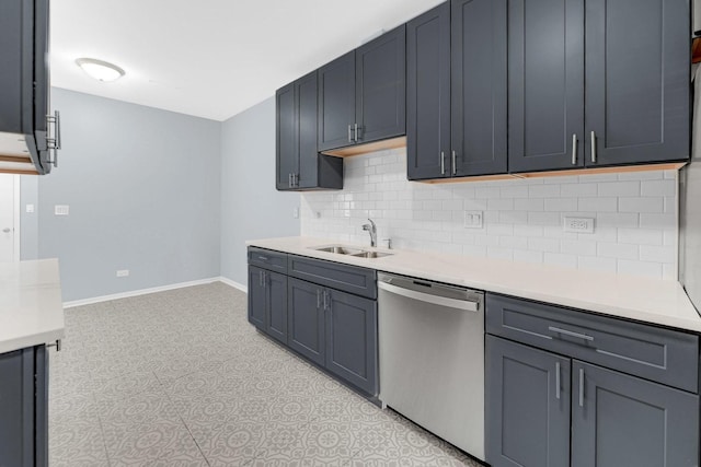 kitchen featuring a sink, light countertops, baseboards, decorative backsplash, and stainless steel dishwasher