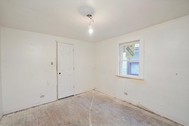 empty room with hardwood / wood-style floors