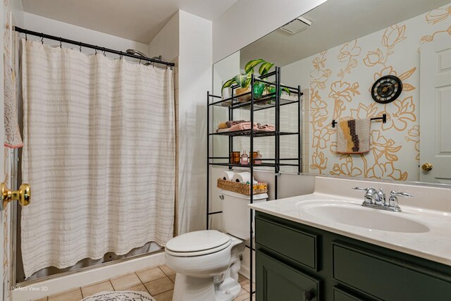 full bath featuring toilet, tile patterned flooring, vanity, and a shower with shower curtain