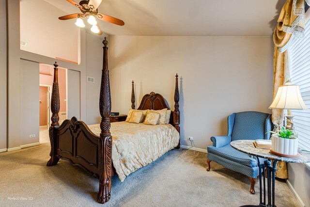 carpeted bedroom featuring visible vents, a ceiling fan, vaulted ceiling, and baseboards