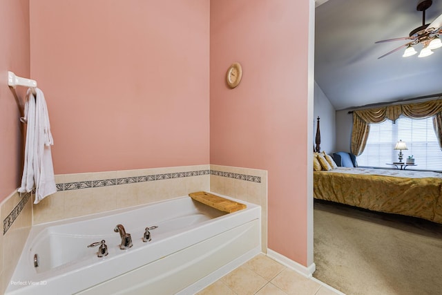 ensuite bathroom featuring ensuite bath, ceiling fan, a bath, and tile patterned flooring
