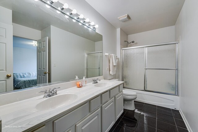 bathroom featuring connected bathroom, visible vents, toilet, and a sink