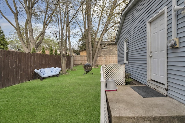 view of yard with a patio and a fenced backyard