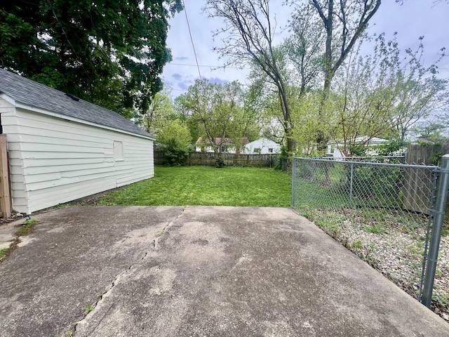 view of patio featuring an outbuilding and a fenced backyard