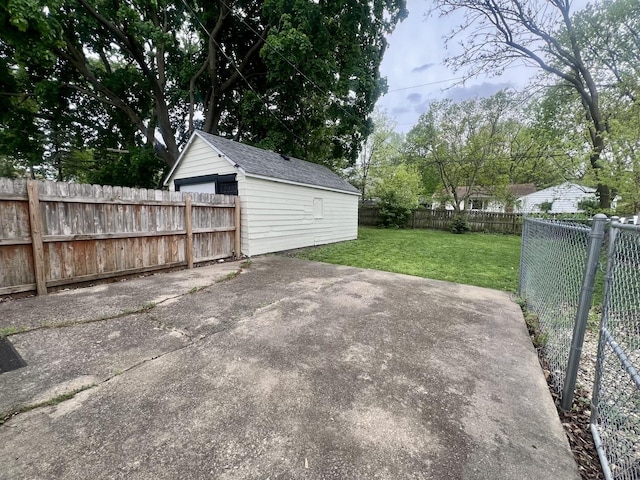 view of patio / terrace featuring an outdoor structure and a fenced backyard