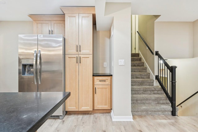 530 Thompson Ave, Winthrop Harbor, IL 60096 - kitchen with stainless steel fridge, light brown cabinetry, light wood-style flooring, and baseboards