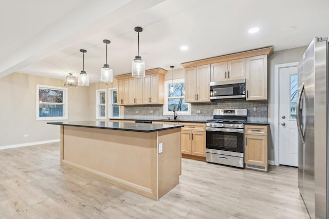530 Thompson Ave, Winthrop Harbor, IL 60096 - kitchen with light brown cabinets, dark countertops, stainless steel appliances, and backsplash