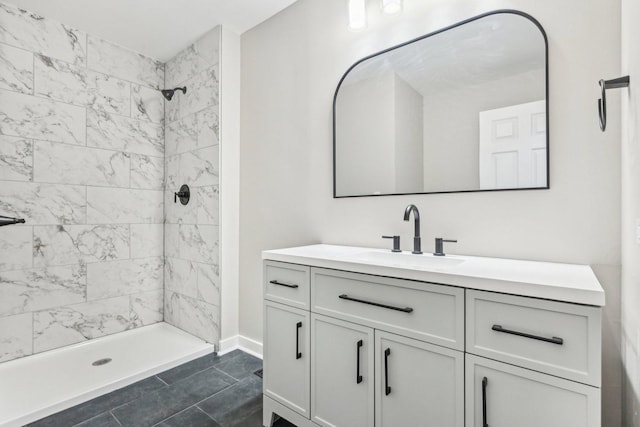 530 Thompson Ave, Winthrop Harbor, IL 60096 - bathroom with a tile shower, vanity, and baseboards