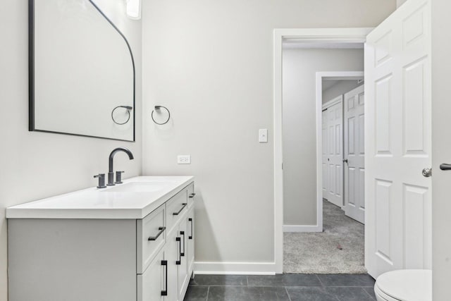 530 Thompson Ave, Winthrop Harbor, IL 60096 - bathroom featuring toilet, vanity, tile patterned flooring, and baseboards