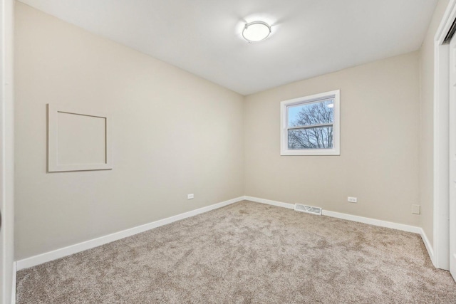 530 Thompson Ave, Winthrop Harbor, IL 60096 - unfurnished room with carpet flooring, visible vents, and baseboards