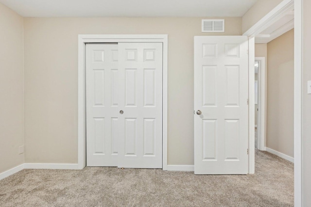 530 Thompson Ave, Winthrop Harbor, IL 60096 - unfurnished bedroom with baseboards, visible vents, a closet, and carpet