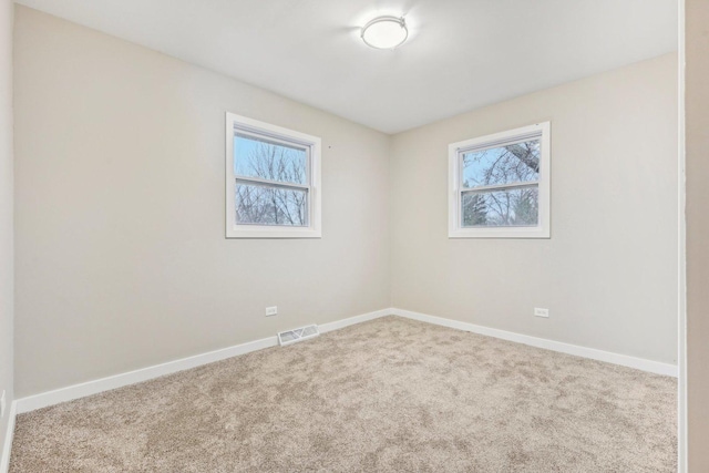 530 Thompson Ave, Winthrop Harbor, IL 60096 - carpeted empty room with baseboards and visible vents