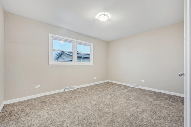 530 Thompson Ave, Winthrop Harbor, IL 60096 - empty room with visible vents, carpet floors, and baseboards