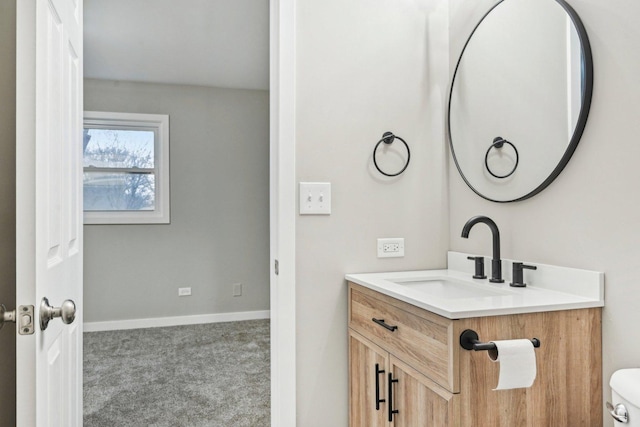 530 Thompson Ave, Winthrop Harbor, IL 60096 - bathroom featuring toilet, vanity, and baseboards