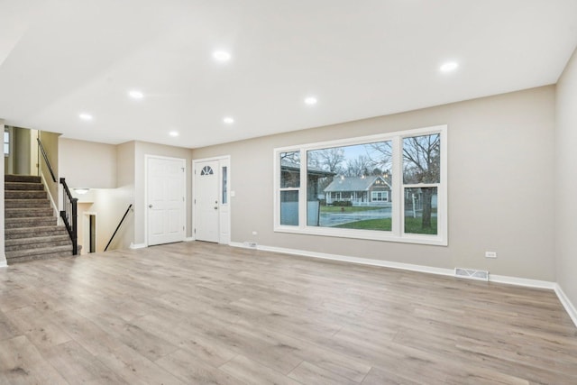 530 Thompson Ave, Winthrop Harbor, IL 60096 - unfurnished living room with recessed lighting, light wood-style floors, stairs, visible vents, and baseboards