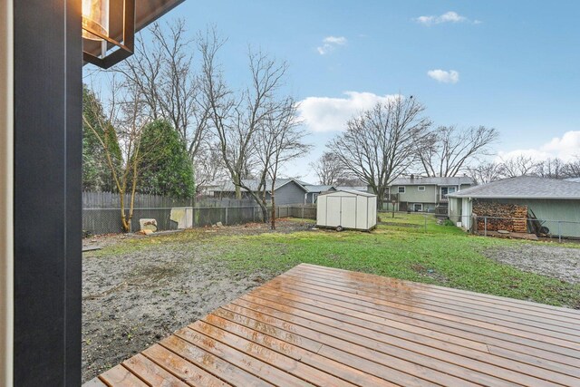 530 Thompson Ave, Winthrop Harbor, IL 60096 - deck with a storage shed, a yard, an outbuilding, and a fenced backyard