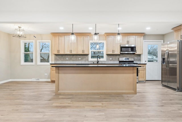 530 Thompson Ave, Winthrop Harbor, IL 60096 - kitchen with a sink, light brown cabinets, appliances with stainless steel finishes, and light wood-style floors
