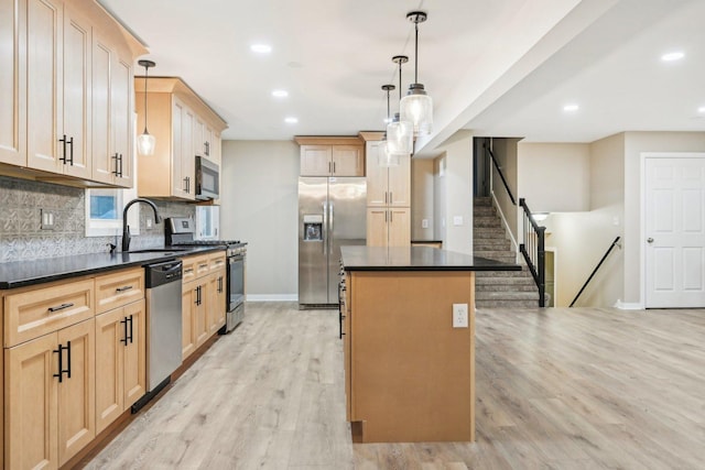 530 Thompson Ave, Winthrop Harbor, IL 60096 - kitchen with a sink, appliances with stainless steel finishes, dark countertops, baseboards, and backsplash