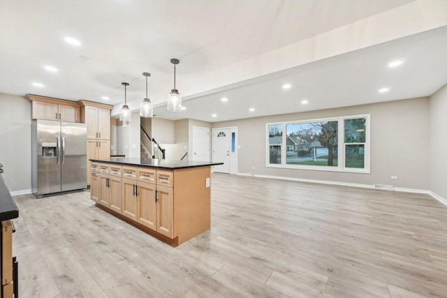 530 Thompson Ave, Winthrop Harbor, IL 60096 - kitchen featuring dark countertops, recessed lighting, light wood-style flooring, and stainless steel fridge with ice dispenser
